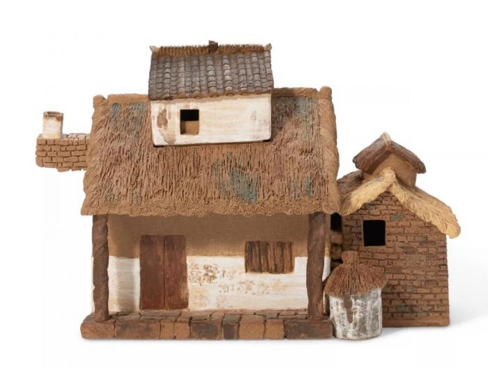 周定芳（1965年生）制茅屋壶，宽 15.3 cm.，1994年。估价：1,500-2,500美元。于即日至3月26日在佳士得网上拍卖壶里乾坤：欧云伉俪珍藏宜兴紫砂器中呈献